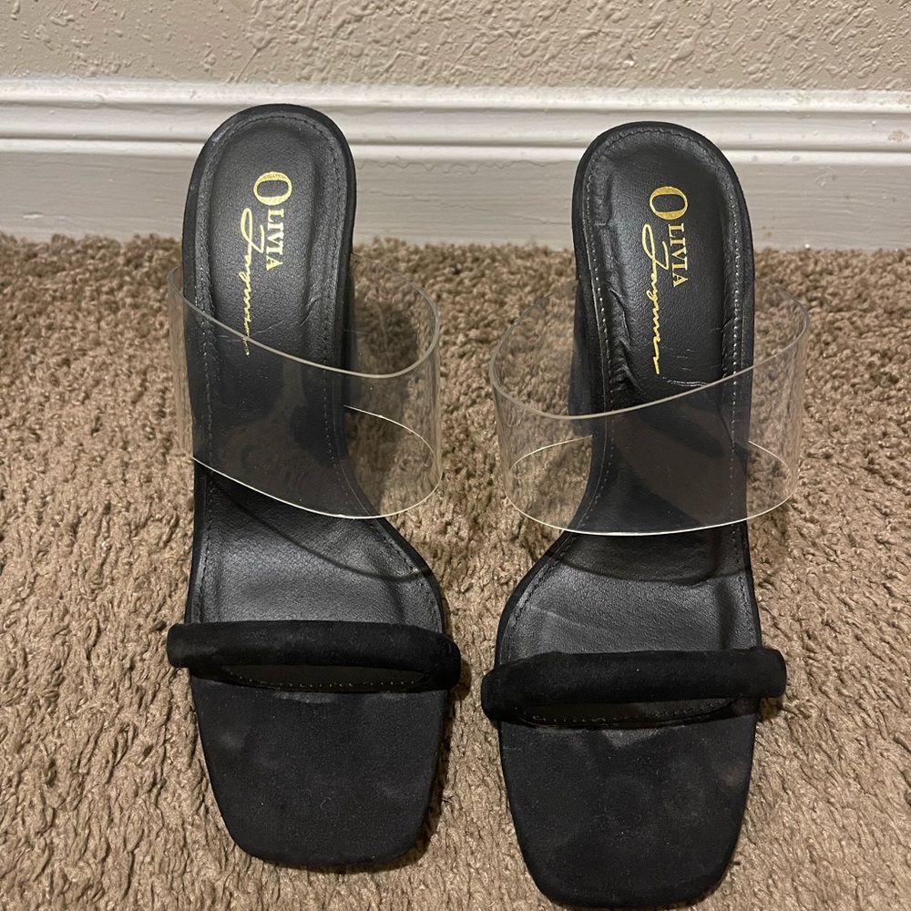 Black/clear heeled sandals.
